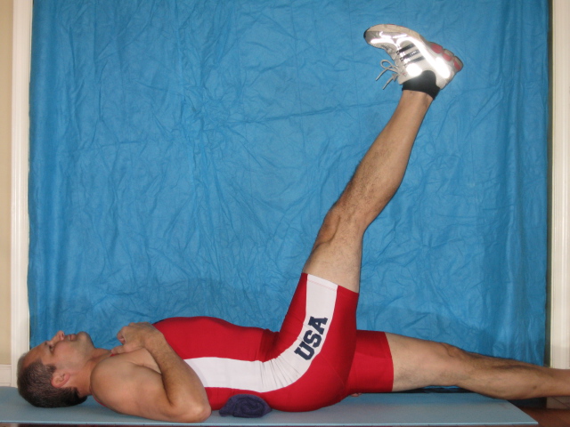 Straight leg raise position, 90 degrees would be vertical. (note towel roll under low back)